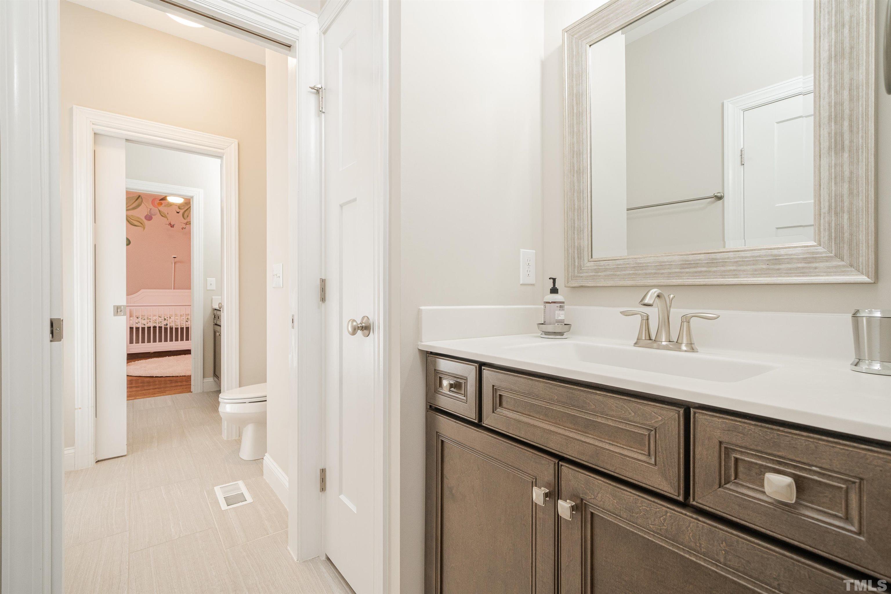616 Connington Way Rolesville, NC 27571 - Photo 45 of 51 a bathroom with a sink and a mirror