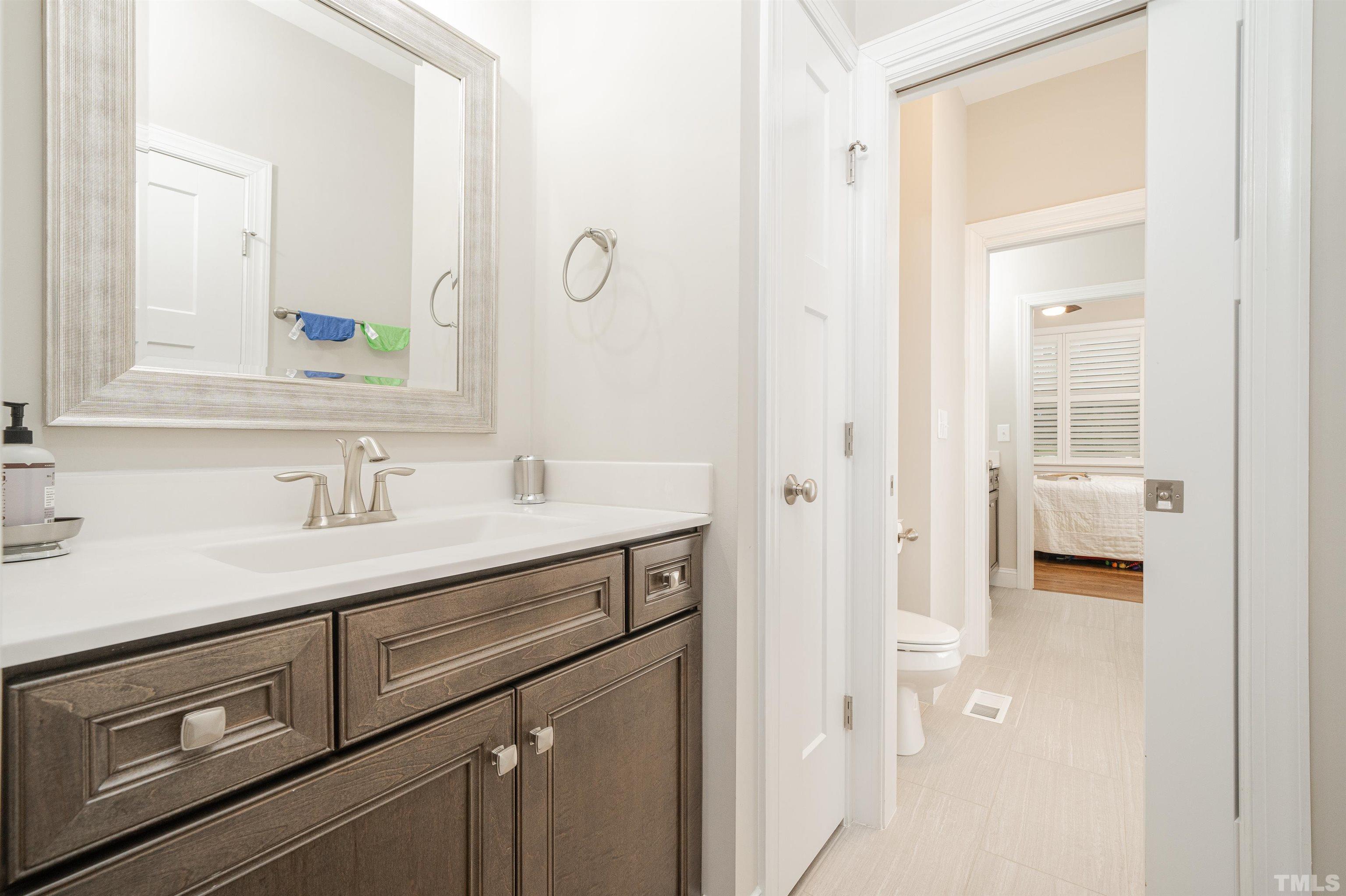 616 Connington Way Rolesville, NC 27571 - Photo 46 of 51 a bathroom with a sink and a mirror