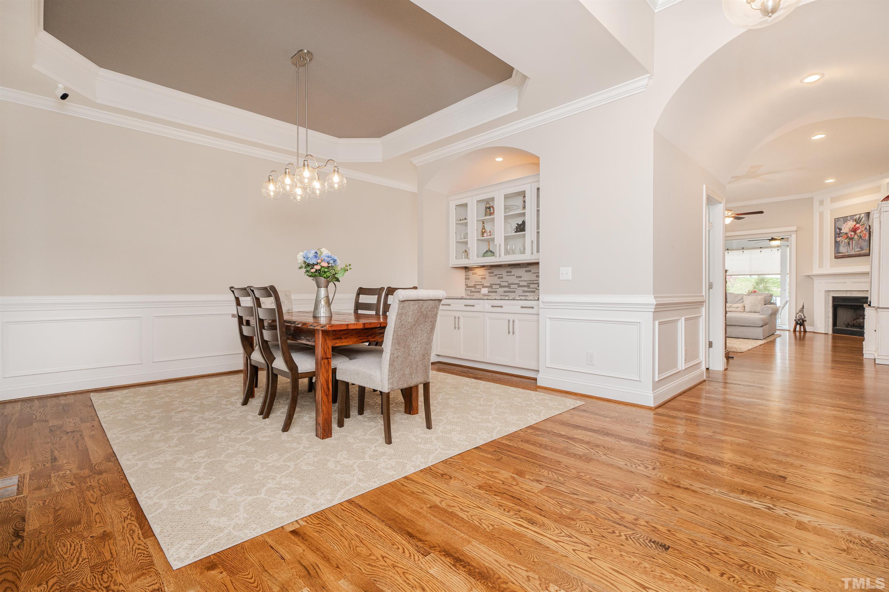 616 Connington Way Rolesville, NC 27571 - Photo 6 of 51 a view of a dining room with furniture and wooden floor