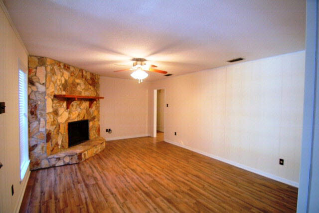 3384 Lacoste Road Mobile, AL 36618 - Photo 8 of 21 Family/Great Room with stone fireplace, new flooring and lighting. 19 x 13