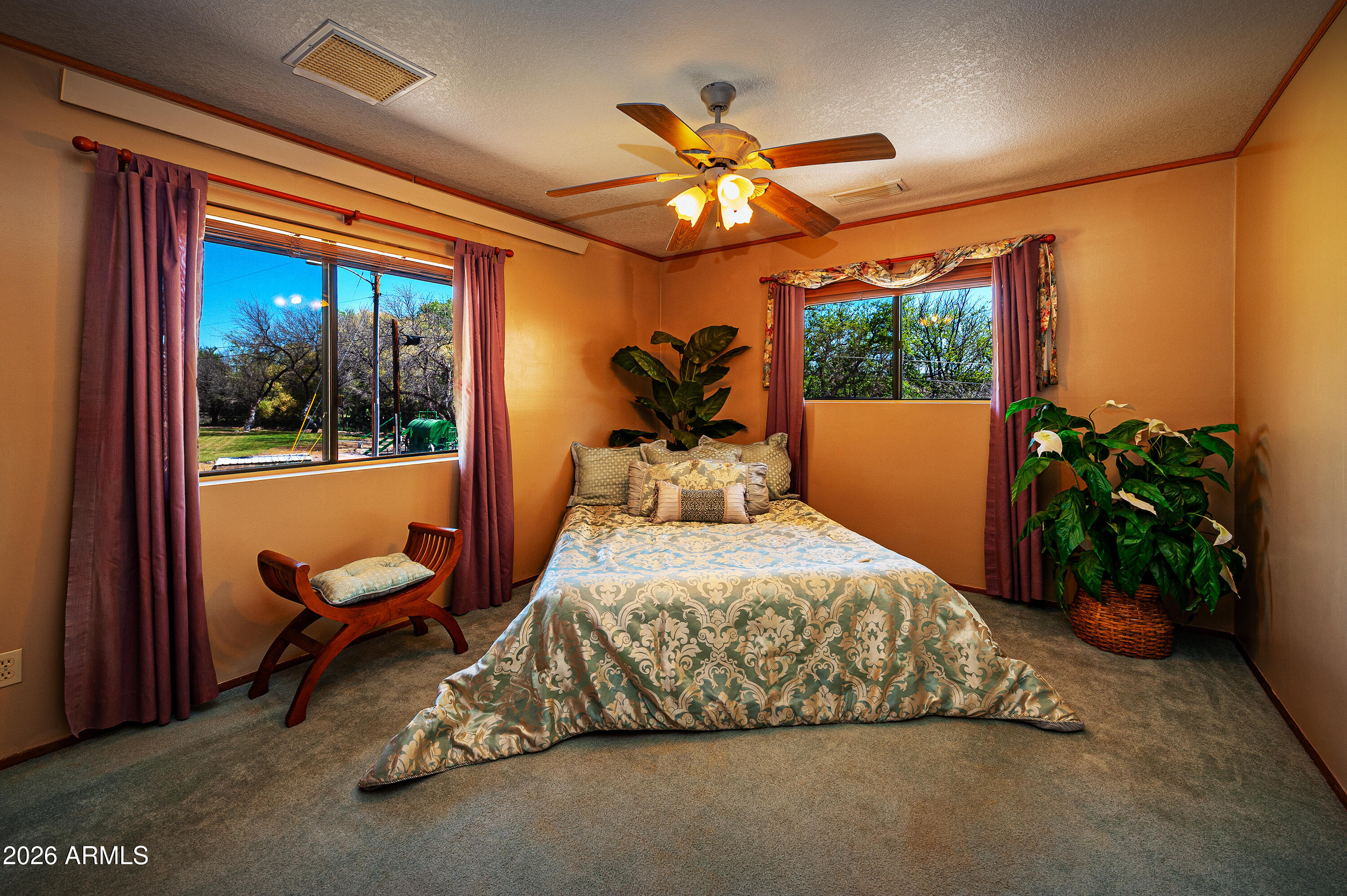 1945 South Loy Road Cornville, AZ 86325 - Photo 13 of 47 a bedroom with a bed and a chandelier