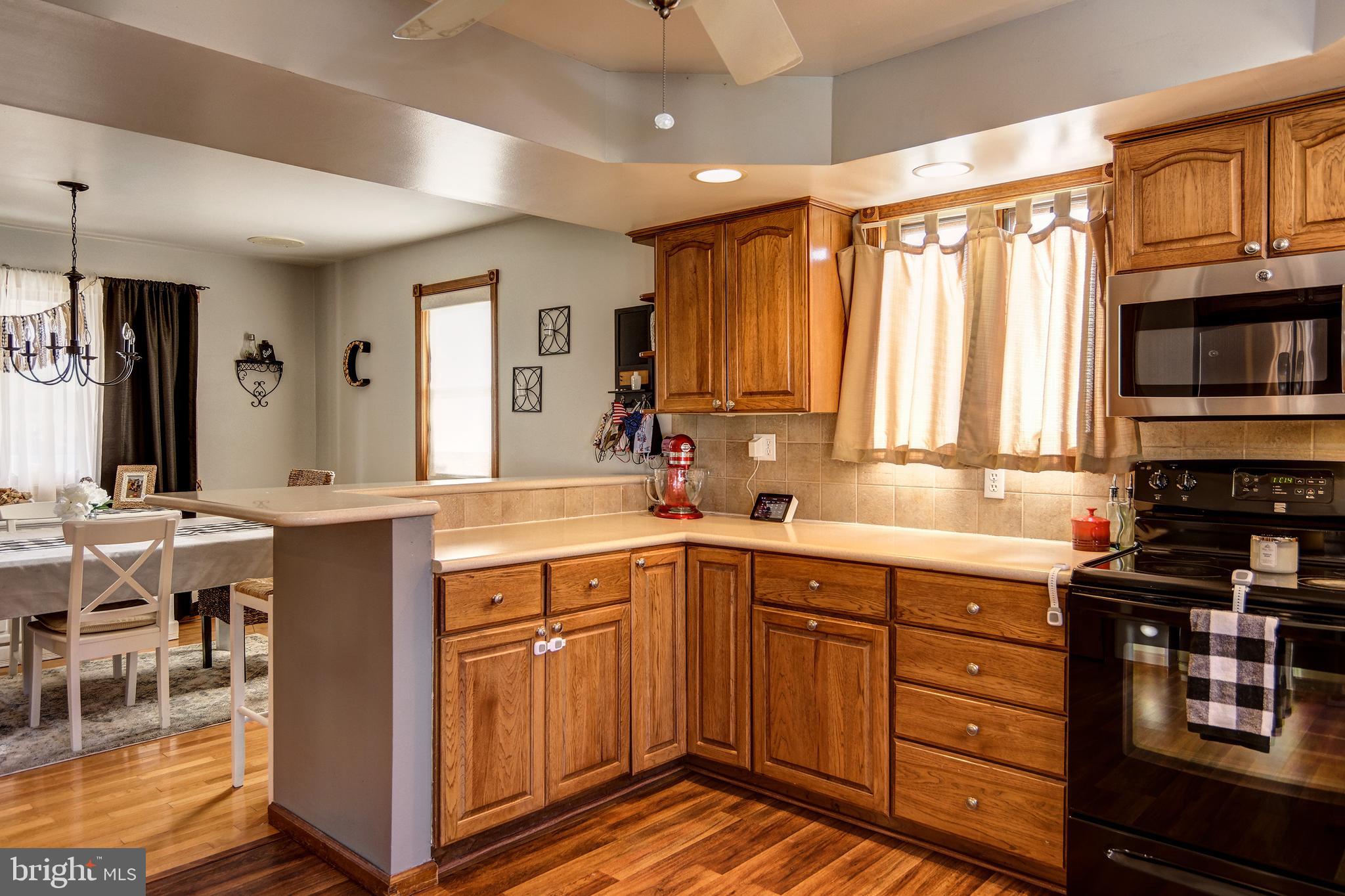 18 Sunset Road Blackwood, NJ 08012 - Photo 11 of 37 a kitchen with a sink stove and cabinets
