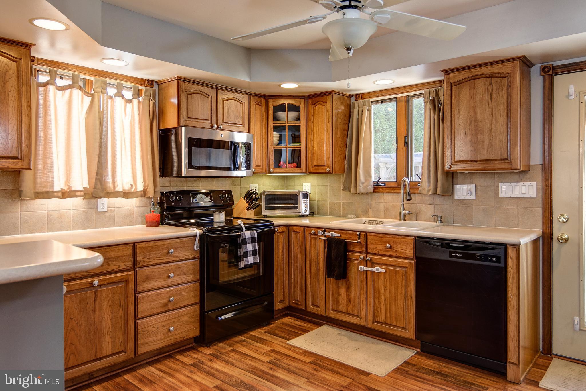 18 Sunset Road Blackwood, NJ 08012 - Photo 12 of 37 a kitchen with stainless steel appliances granite countertop a stove sink and cabinets