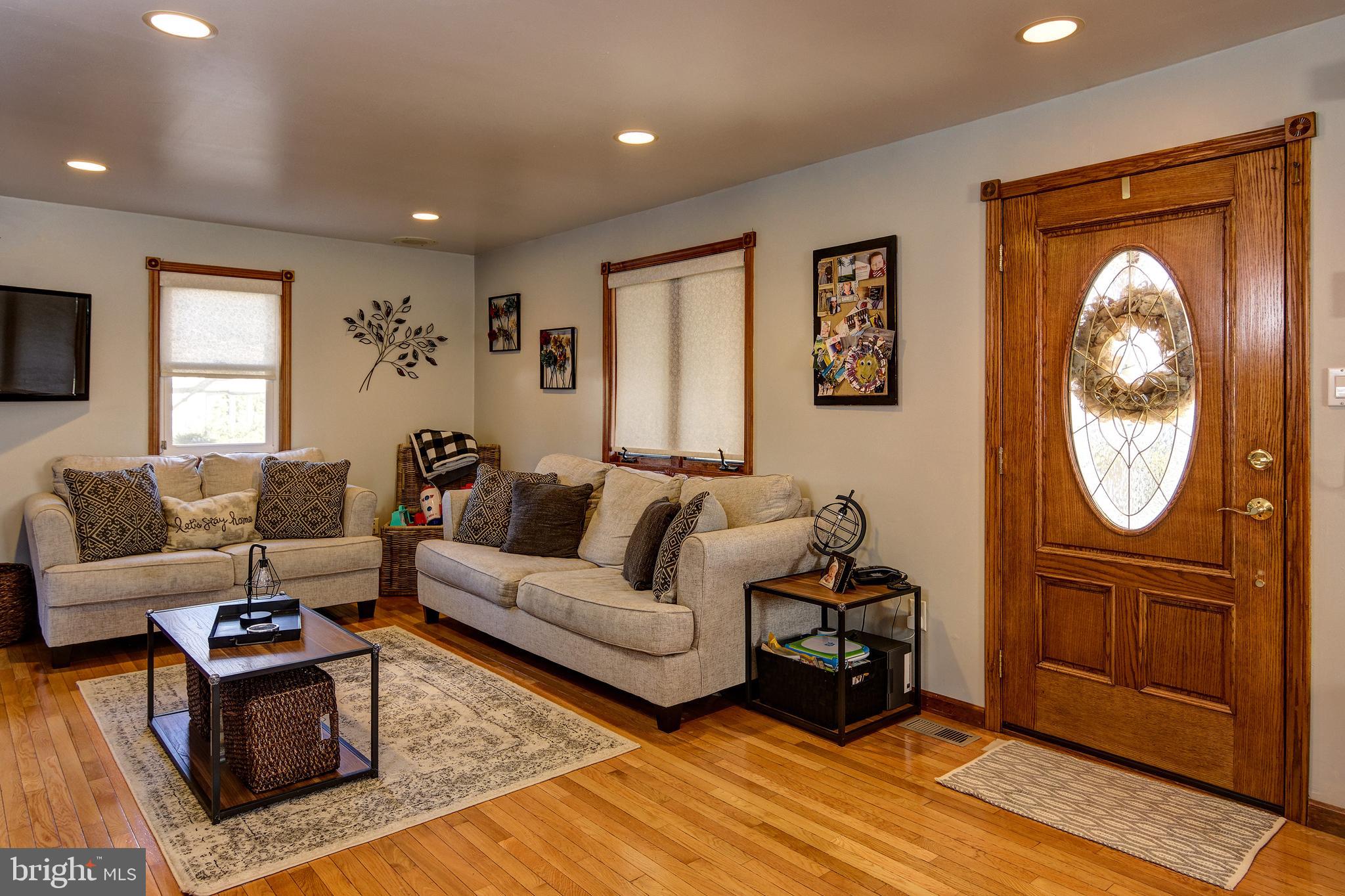 18 Sunset Road Blackwood, NJ 08012 - Photo 3 of 37 a living room with furniture a window and a flat screen tv