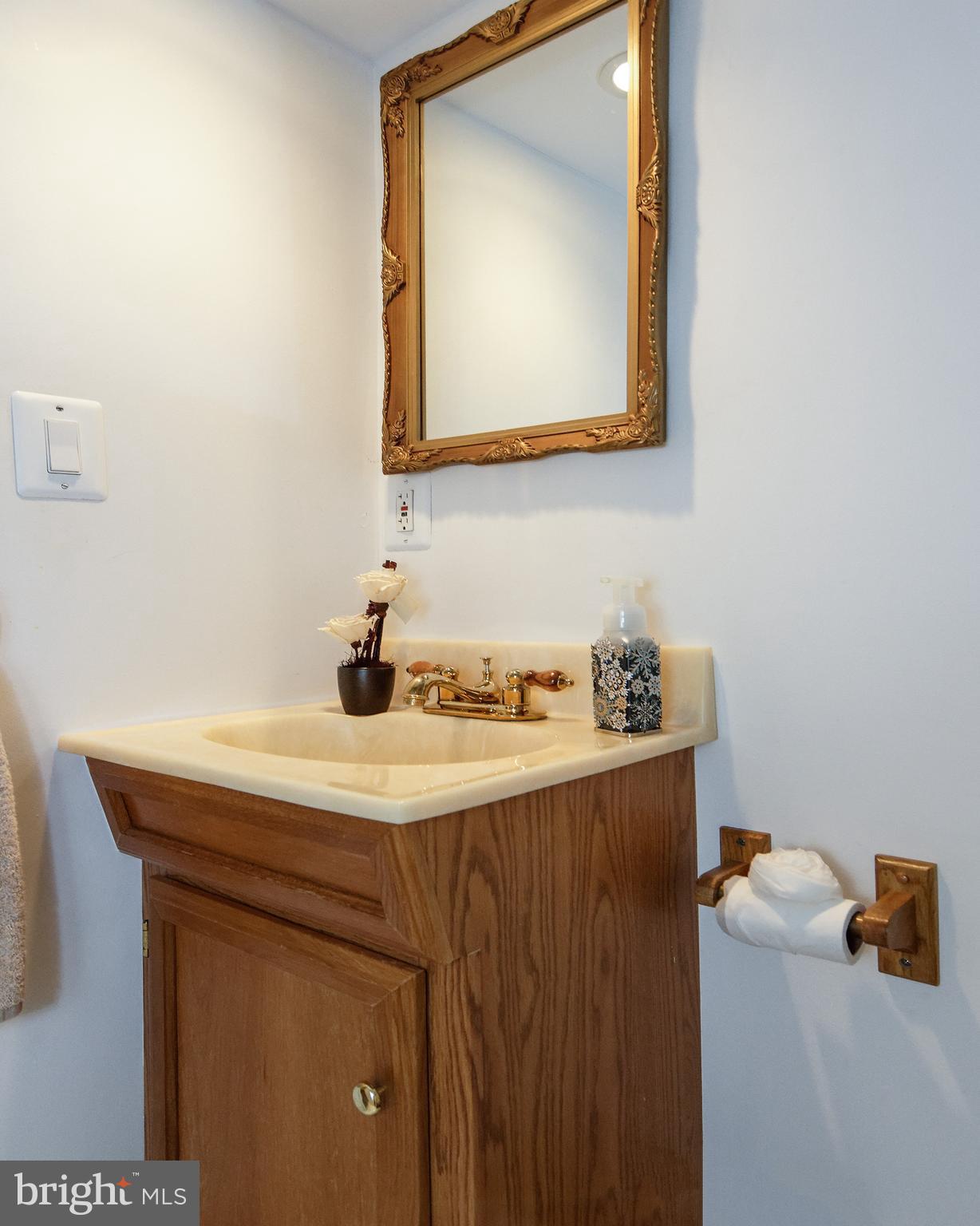 18 Sunset Road Blackwood, NJ 08012 - Photo 21 of 37 a bathroom with a sink a mirror and vanity
