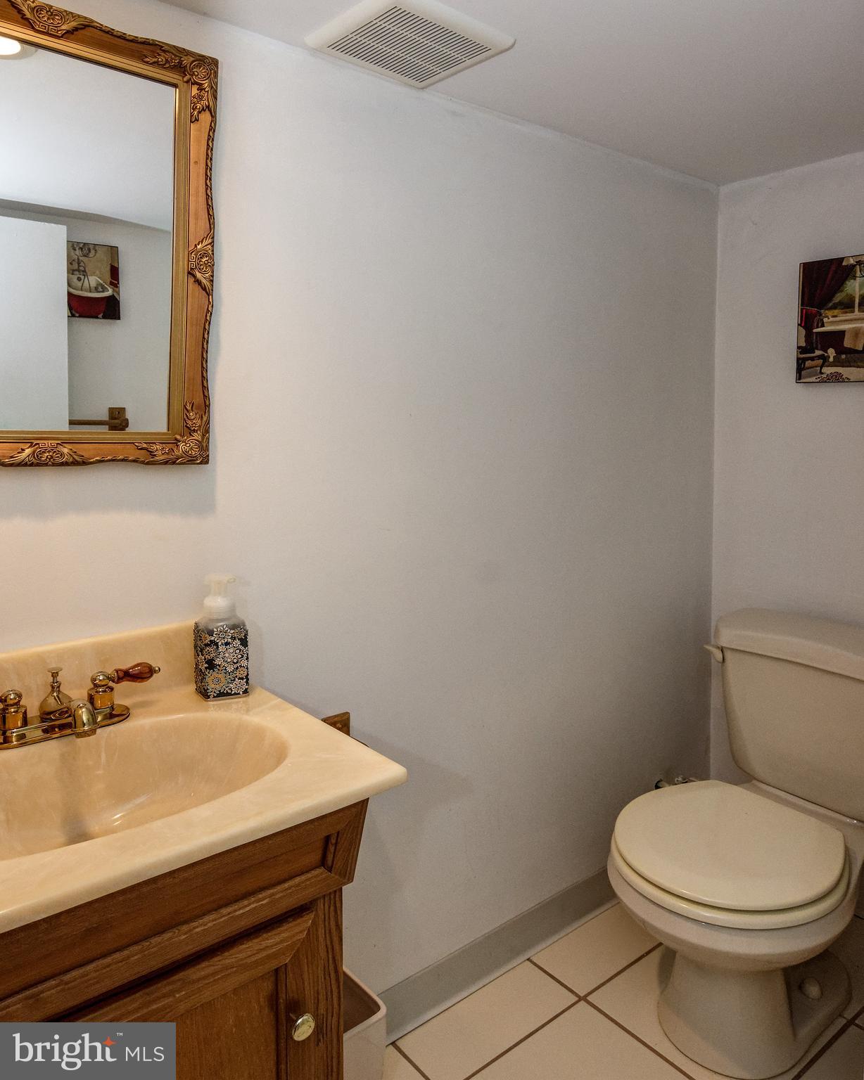18 Sunset Road Blackwood, NJ 08012 - Photo 22 of 37 a bathroom with a sink a toilet and mirror