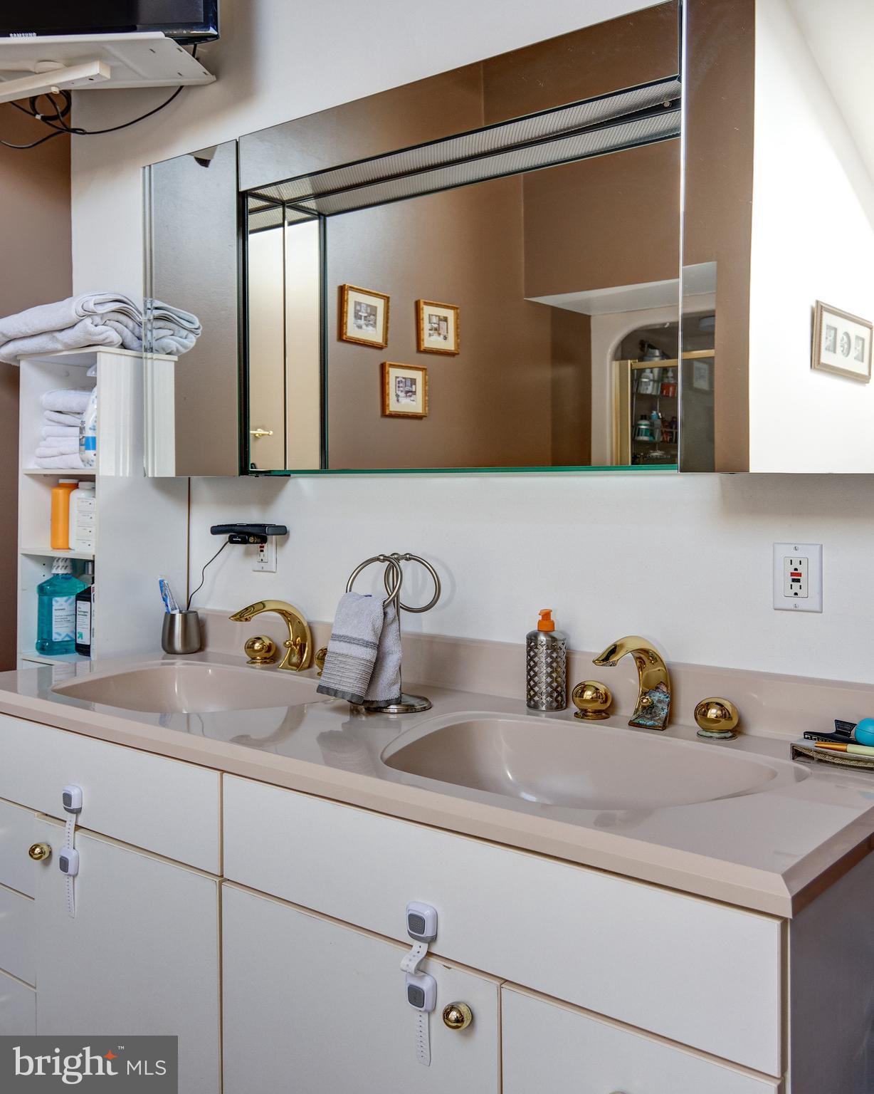 18 Sunset Road Blackwood, NJ 08012 - Photo 27 of 37 a bathroom with a sink and two mirror