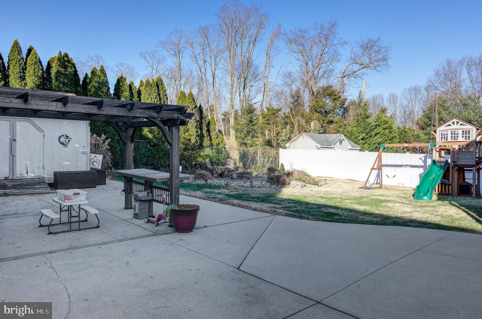18 Sunset Road Blackwood, NJ 08012 - Photo 34 of 37 a view of backyard with a table and chairs