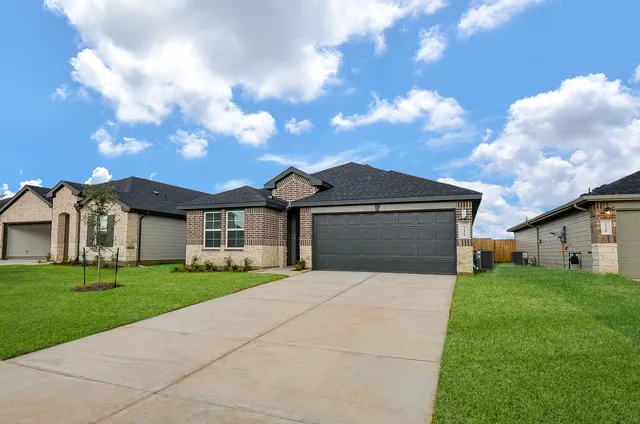 a front view of a house with yard