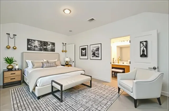 a bedroom with a bed and a couch