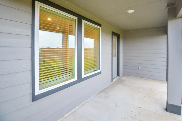 a outdoor living space with furniture and a potted plant