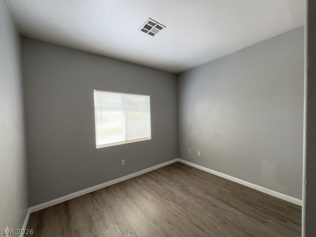 4915 East Russell Road, Unit 115 Las Vegas, NV 89120 - Photo 7 of 7 This versatile room offers ample natural light and a clean, neutral palette.