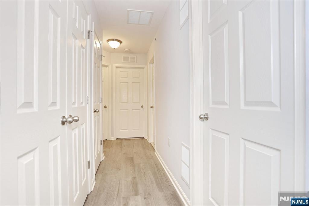 4 Masterson Court, Unit 4 Waldwick, NJ 07463 - Photo 21 of 26 a view of a hallway with wooden floor