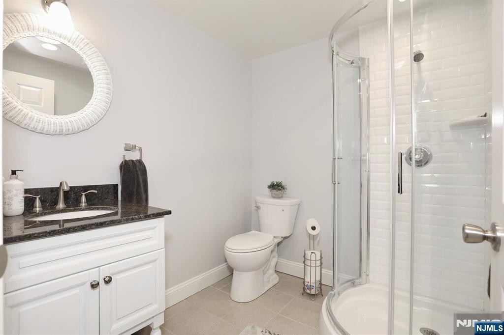 4 Masterson Court, Unit 4 Waldwick, NJ 07463 - Photo 25 of 26 a bathroom with a toilet and a sink