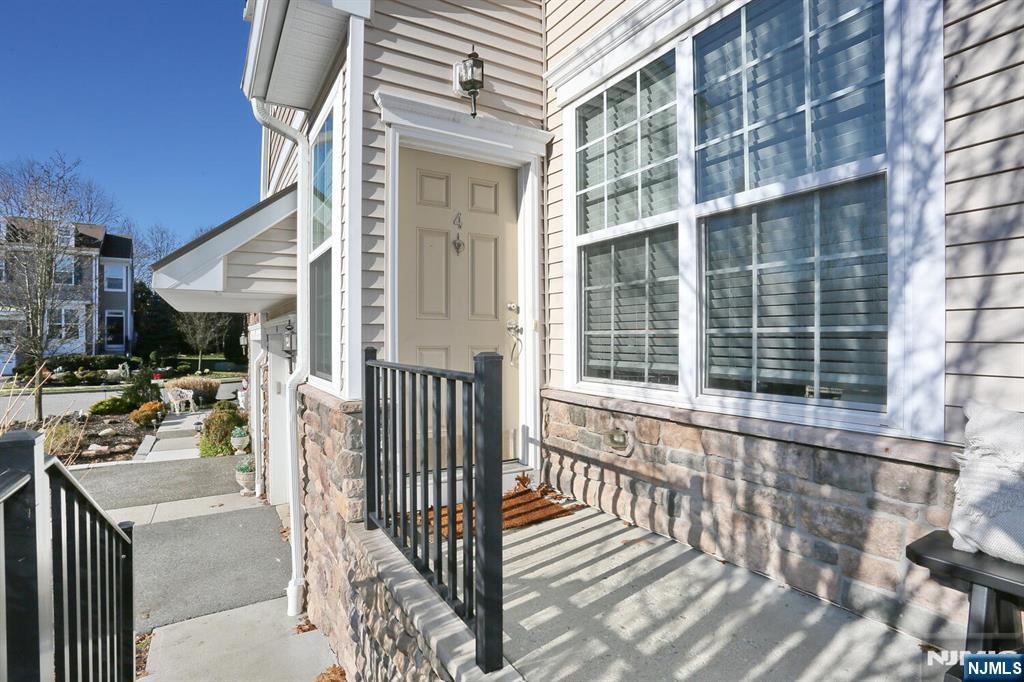 4 Masterson Court, Unit 4 Waldwick, NJ 07463 - Photo 3 of 26 a view of a building with a porch