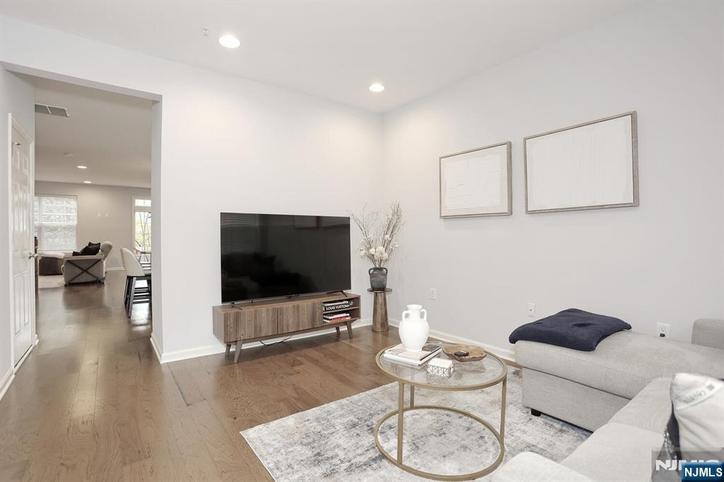 4 Masterson Court, Unit 4 Waldwick, NJ 07463 - Photo 4 of 26 a living room with furniture and a flat screen tv