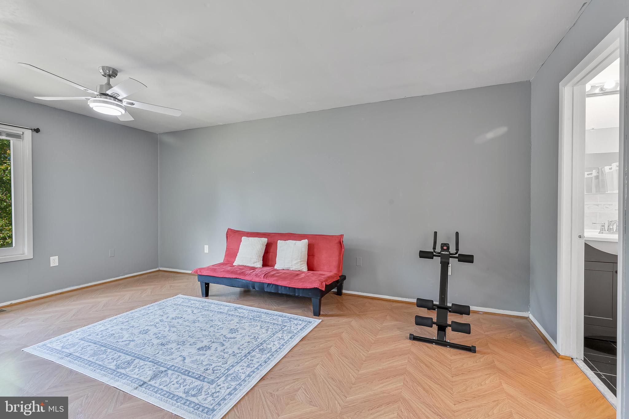 9108 Centerway Road Gaithersburg, MD 20879 - Photo 12 of 33 a bedroom with furniture and a rug