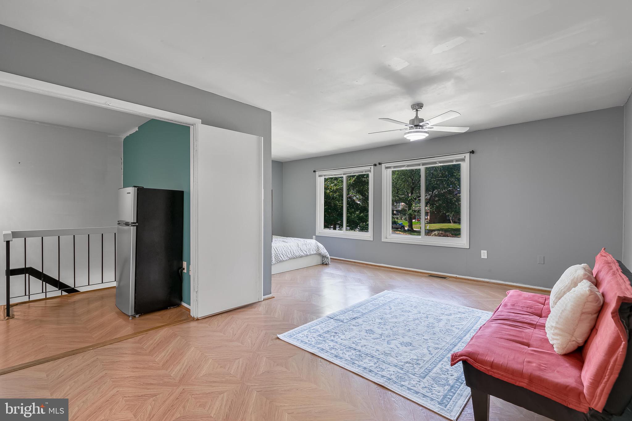 9108 Centerway Road Gaithersburg, MD 20879 - Photo 13 of 33 a living room with furniture and a window