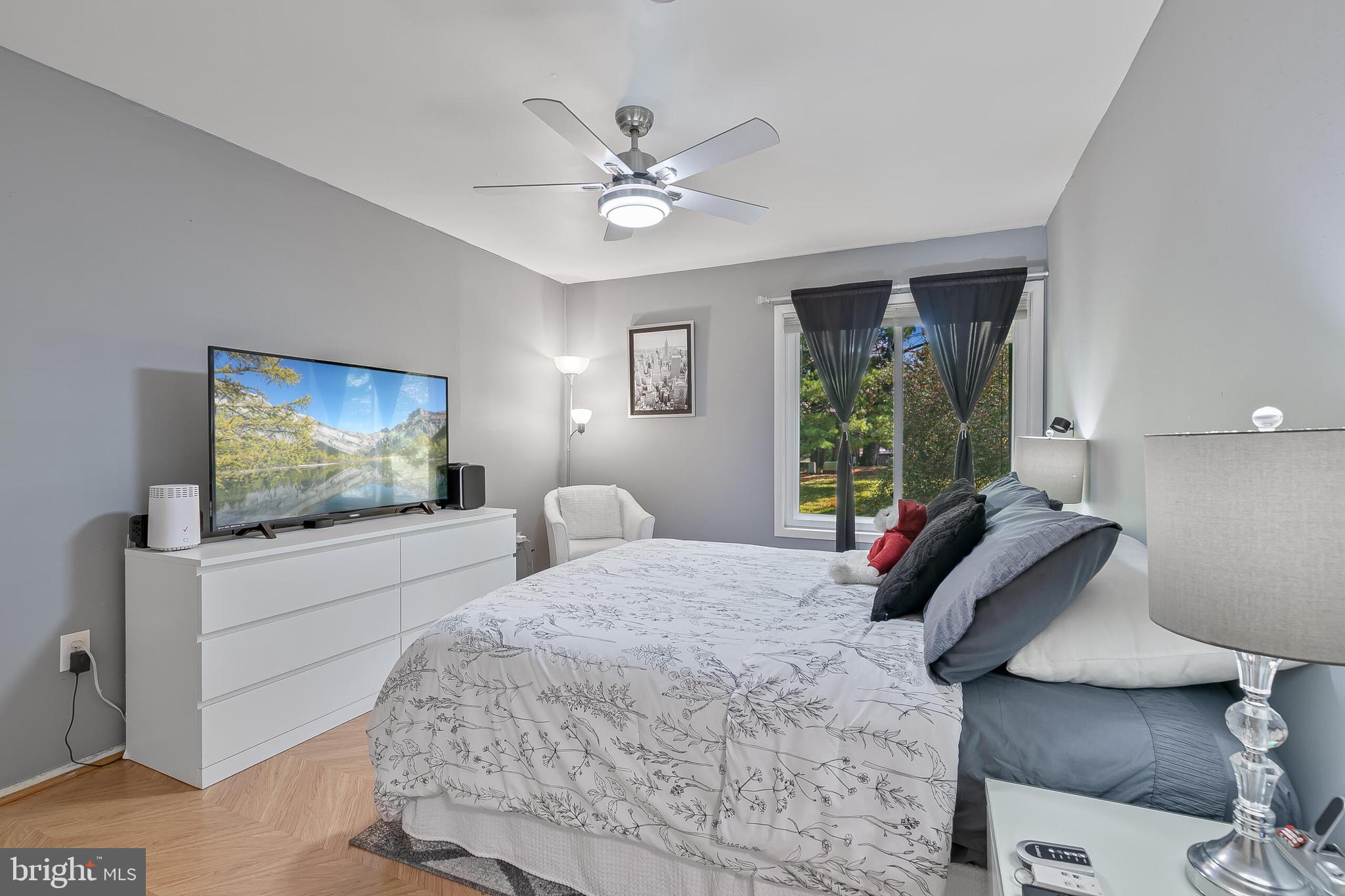 9108 Centerway Road Gaithersburg, MD 20879 - Photo 16 of 33 a bedroom with a bed and a flat screen tv