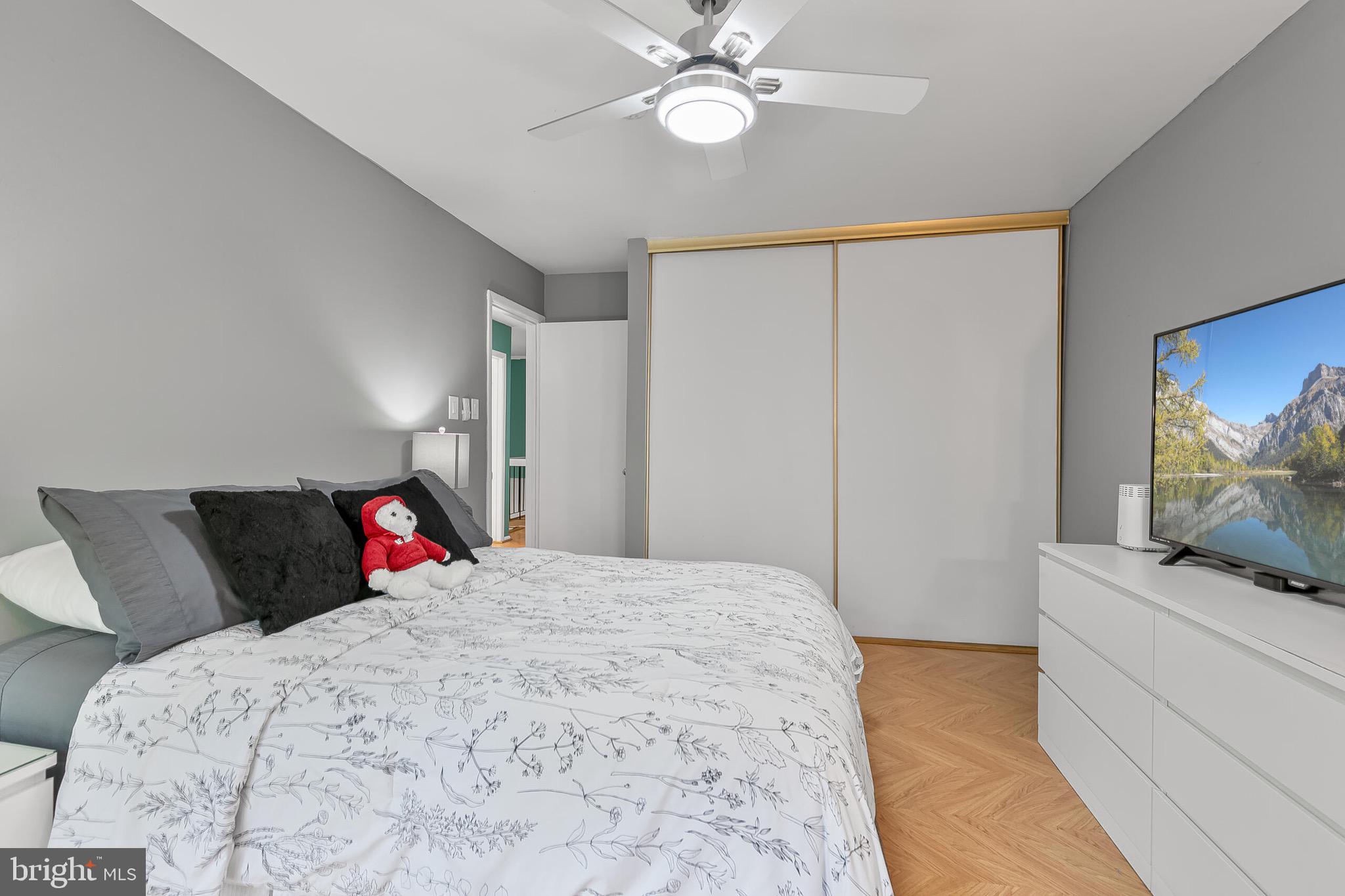 9108 Centerway Road Gaithersburg, MD 20879 - Photo 17 of 33 a bedroom with a bed and a chandelier