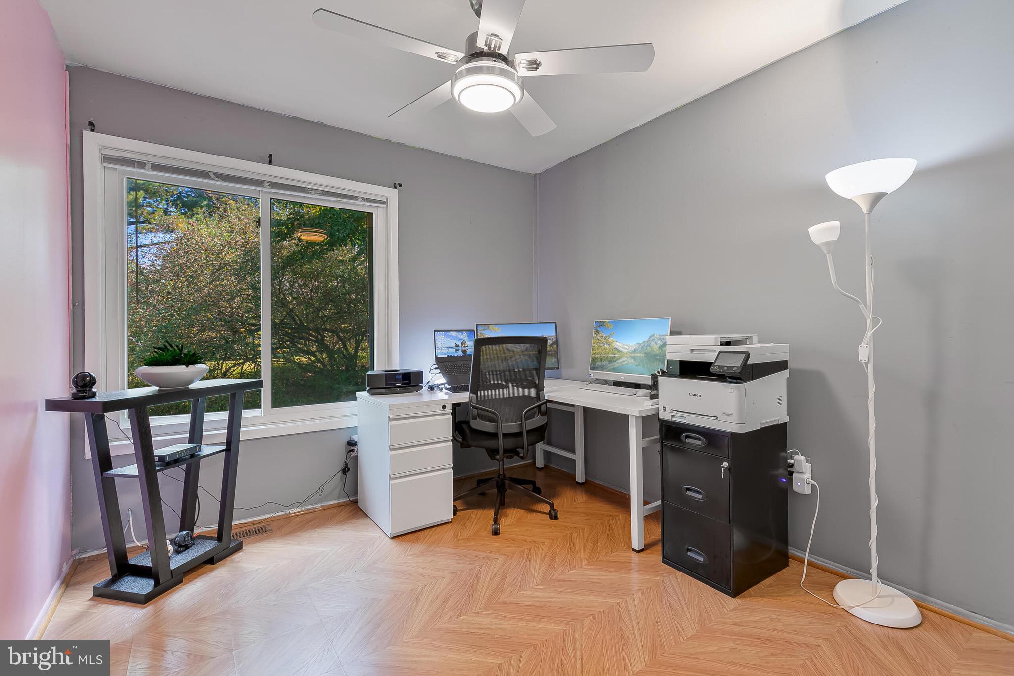 9108 Centerway Road Gaithersburg, MD 20879 - Photo 18 of 33 a view of a workspace with furniture and a window