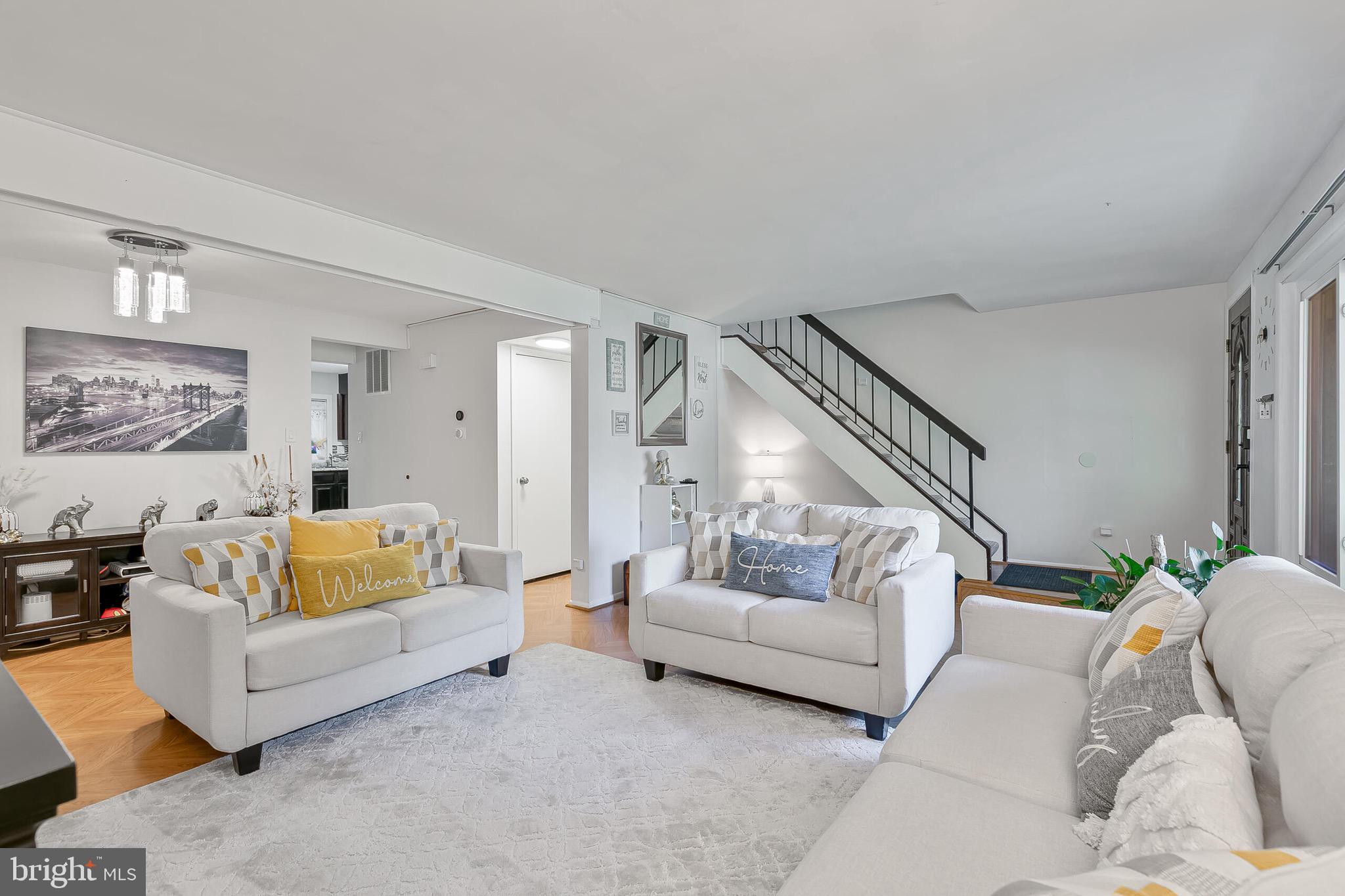 9108 Centerway Road Gaithersburg, MD 20879 - Photo 2 of 33 a living room with furniture and a couch
