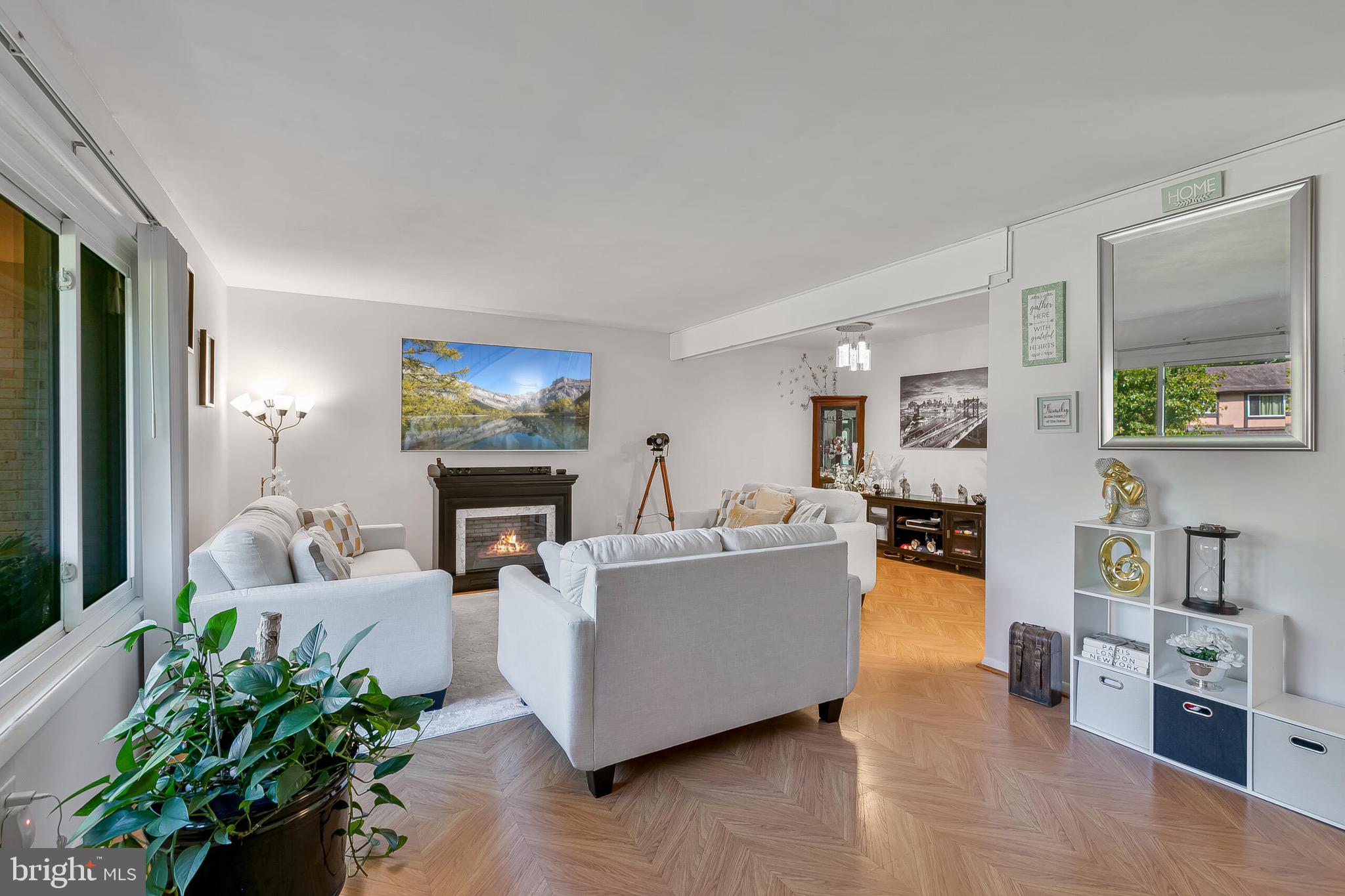 9108 Centerway Road Gaithersburg, MD 20879 - Photo 22 of 33 a living room with furniture and a fireplace