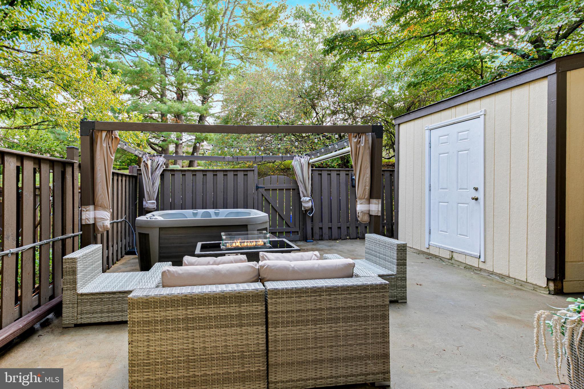9108 Centerway Road Gaithersburg, MD 20879 - Photo 26 of 33 a wooden bench sitting in front of a building