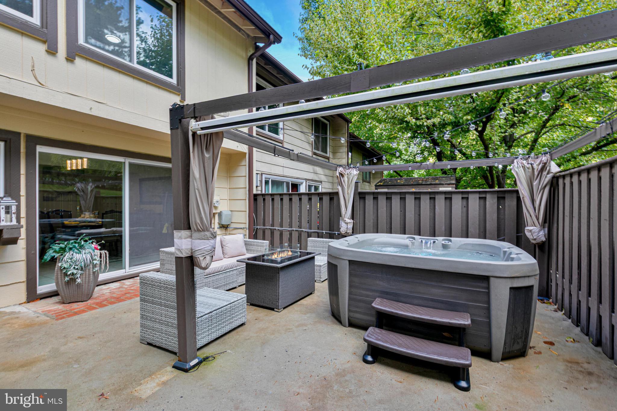 9108 Centerway Road Gaithersburg, MD 20879 - Photo 27 of 33 a view of a patio with a table and chairs
