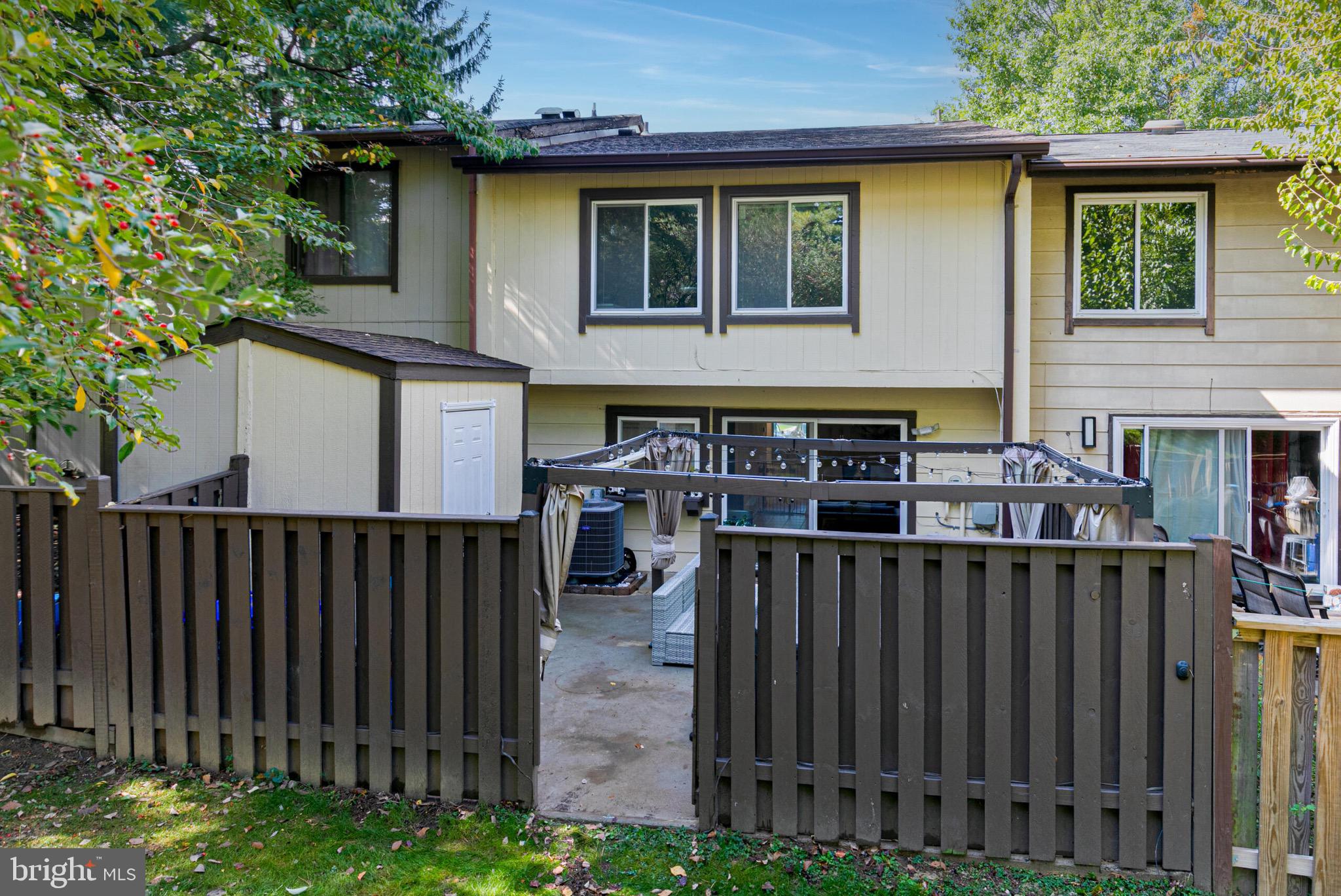 9108 Centerway Road Gaithersburg, MD 20879 - Photo 31 of 33 a view of a house with wooden fence