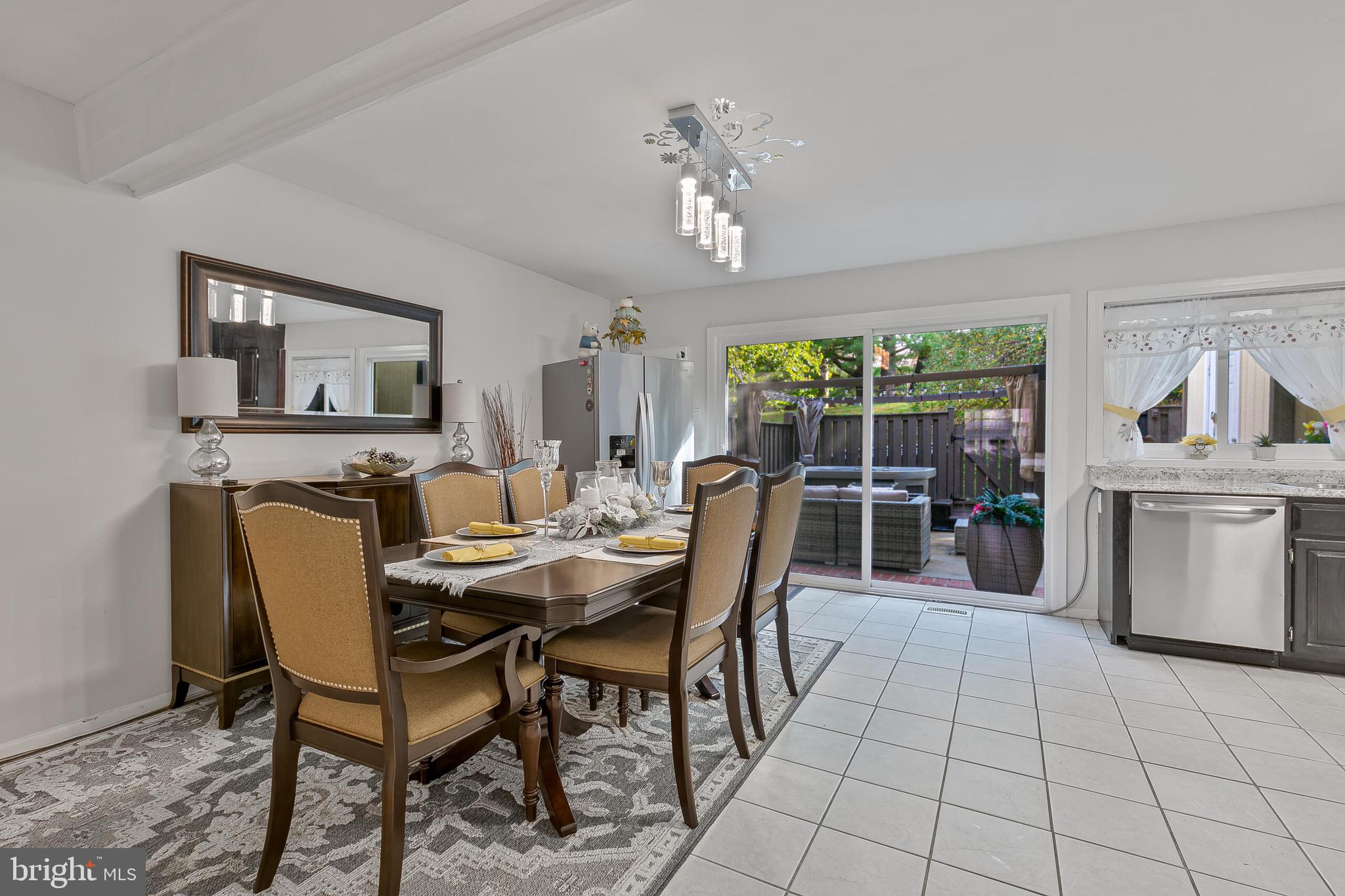 9108 Centerway Road Gaithersburg, MD 20879 - Photo 7 of 33 a view of a dining room with furniture window and outside view