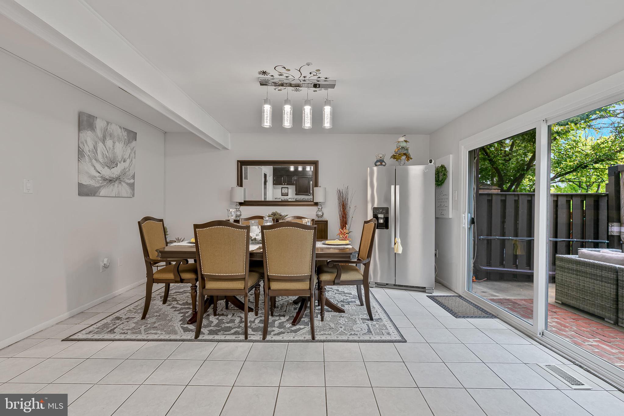 9108 Centerway Road Gaithersburg, MD 20879 - Photo 8 of 33 a view of a dining room with furniture