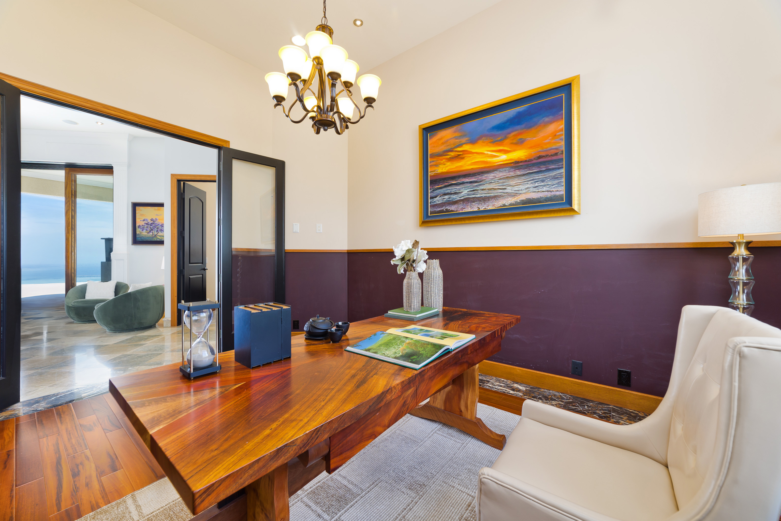 92-8322 Jacaranda Drive Ocean View, HI 96704 - Photo 14 of 30 a living room with furniture and a chandelier