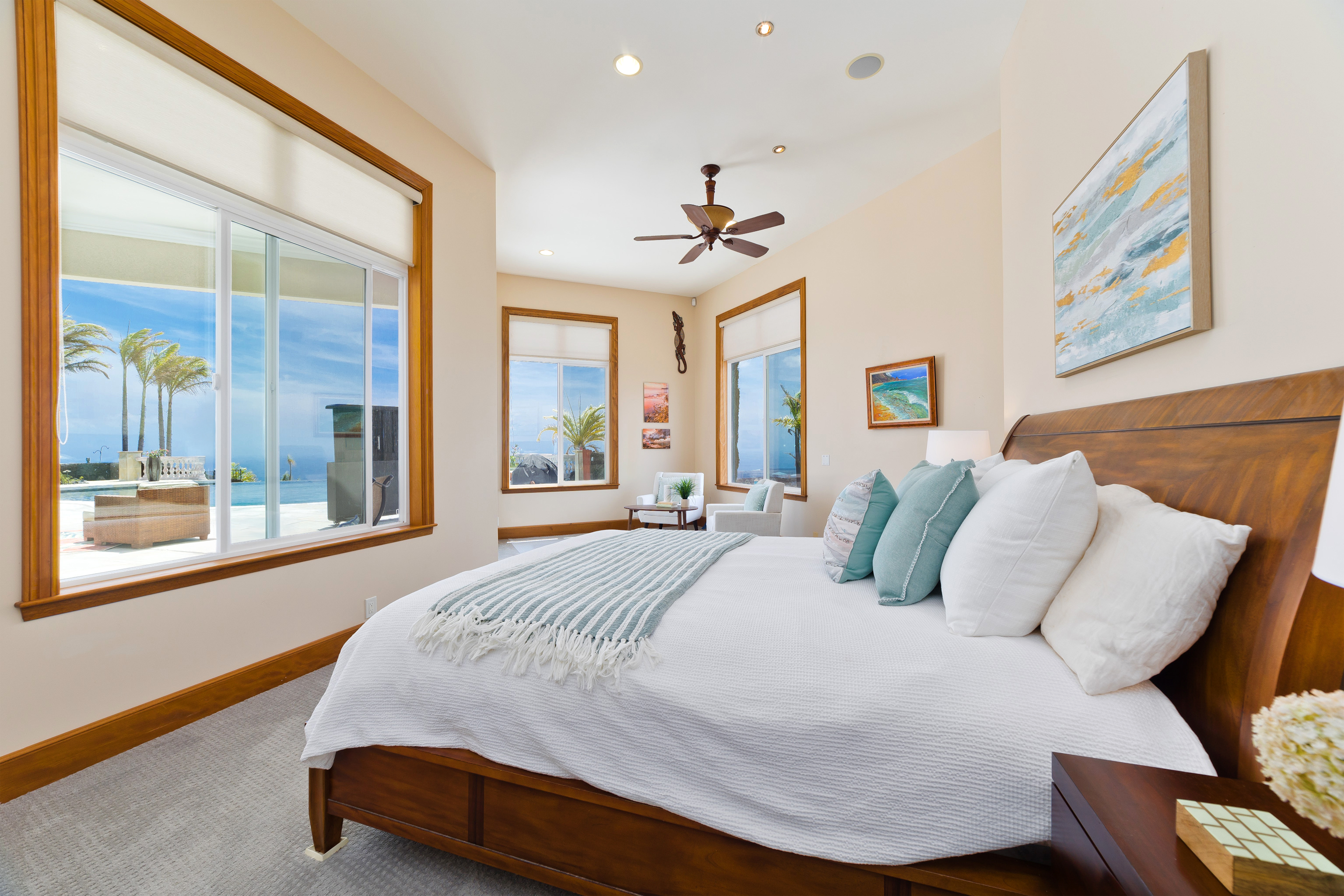 92-8322 Jacaranda Drive Ocean View, HI 96704 - Photo 16 of 30 a bedroom with a bed and a painting on the wall