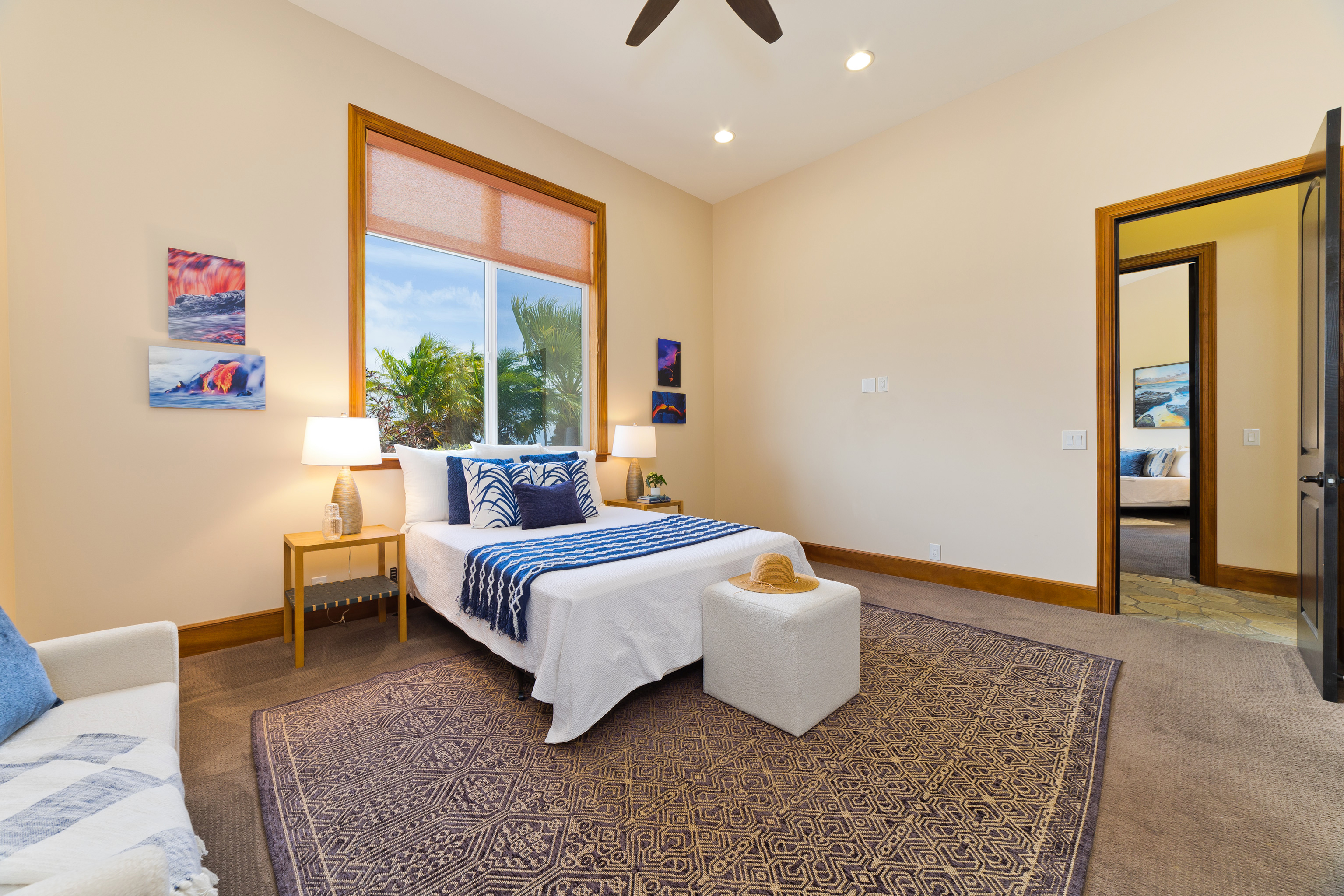 92-8322 Jacaranda Drive Ocean View, HI 96704 - Photo 19 of 30 a bedroom with a bed and a window