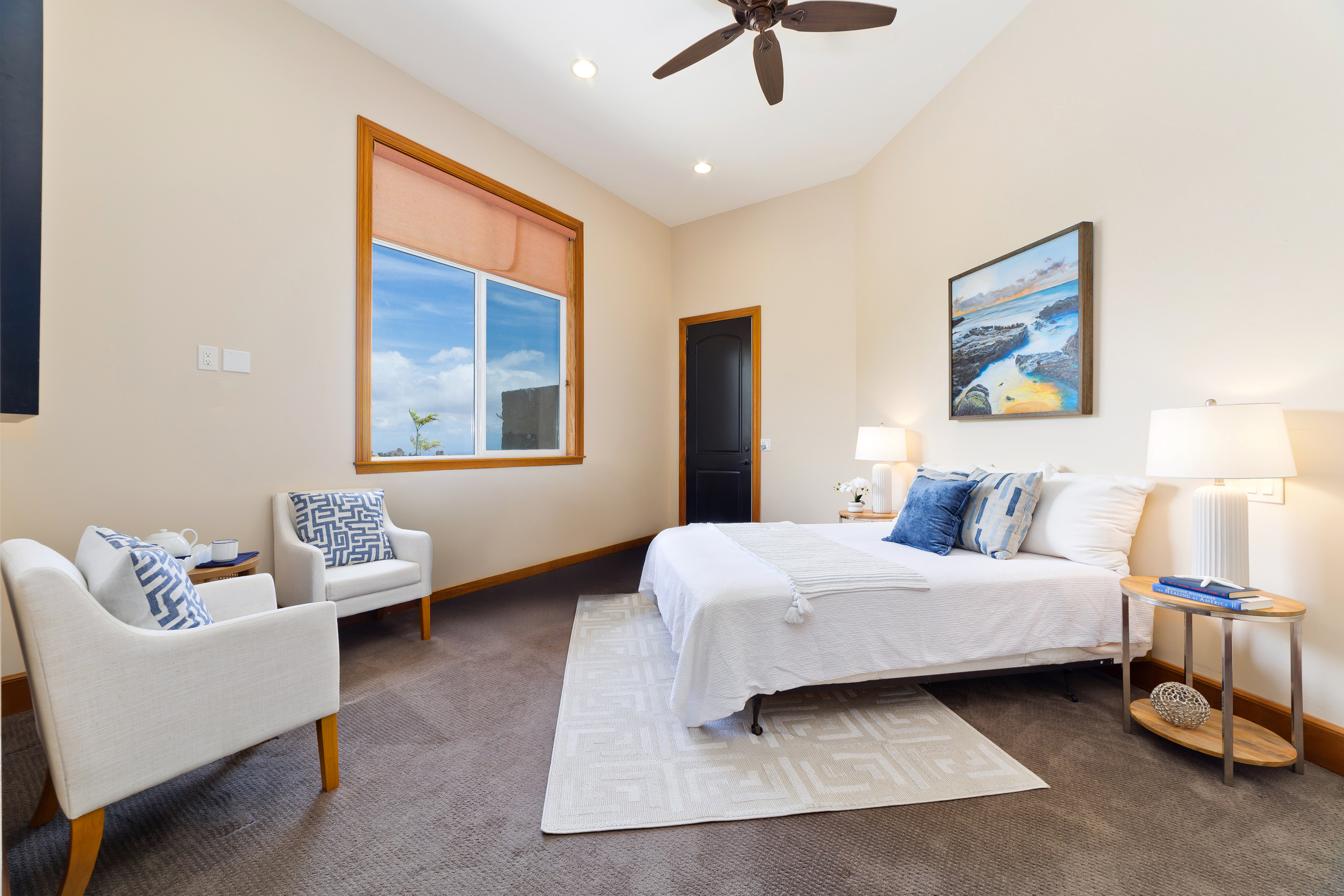 92-8322 Jacaranda Drive Ocean View, HI 96704 - Photo 20 of 30 a bedroom with a bed couches and window