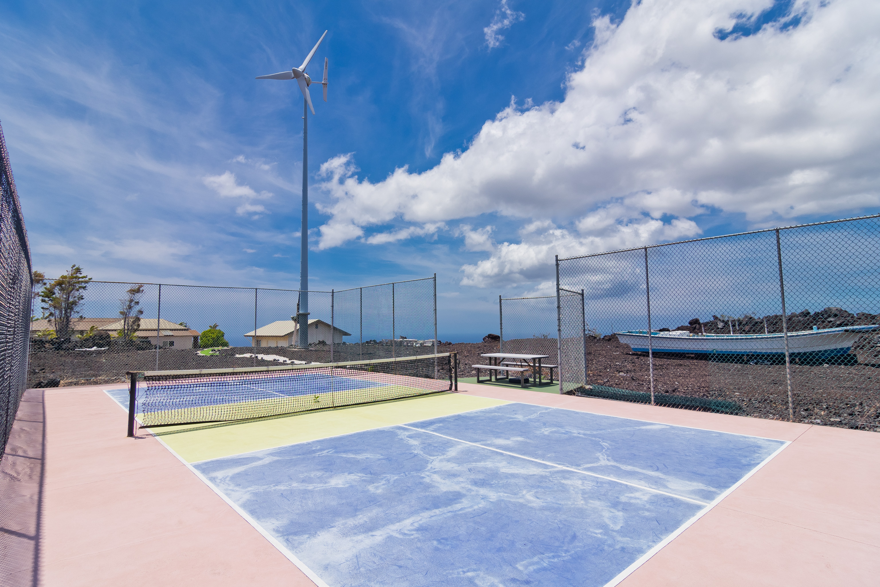 92-8322 Jacaranda Drive Ocean View, HI 96704 - Photo 27 of 30 a view of a swimming pool with a chair