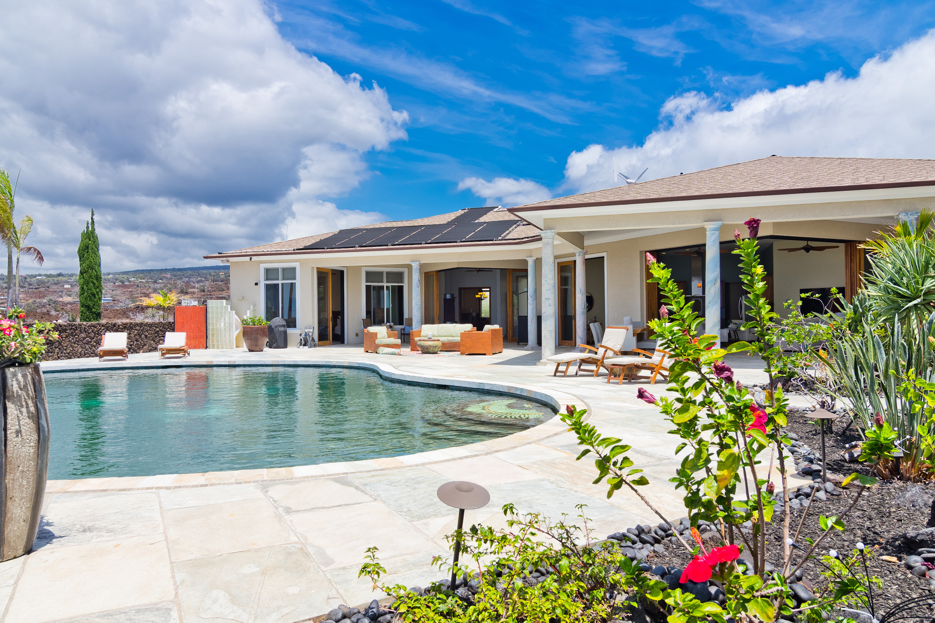 92-8322 Jacaranda Drive Ocean View, HI 96704 - Photo 8 of 30 a view of a house with swimming pool and porch with furniture