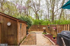 17 Devon Court Sterling, VA 20165 - Photo 24 of 30 a view of a deck with a large window and wooden fence