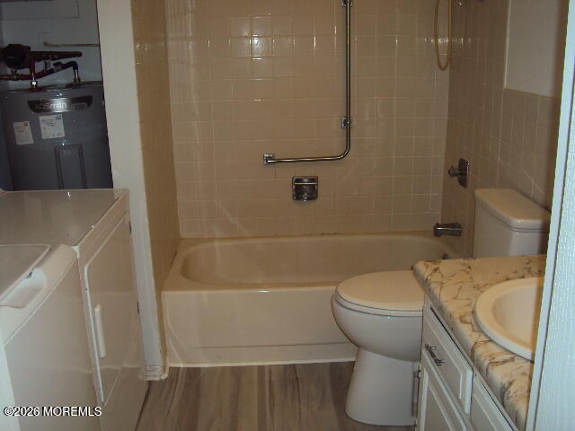 12 Spring Street, Unit D Whiting, NJ 08759 - Photo 12 of 14 a bathroom with a sink a toilet and shower