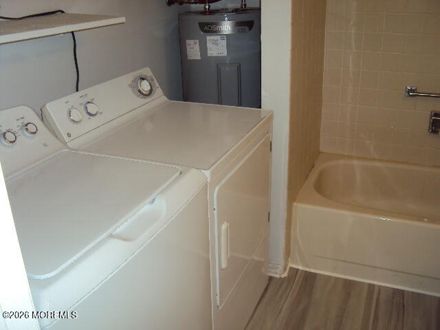 12 Spring Street, Unit D Whiting, NJ 08759 - Photo 14 of 14 a utility room with dryer and washer