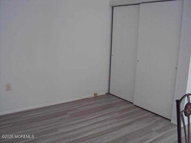 12 Spring Street, Unit D Whiting, NJ 08759 - Photo 7 of 14 a view of an empty room with wooden floor