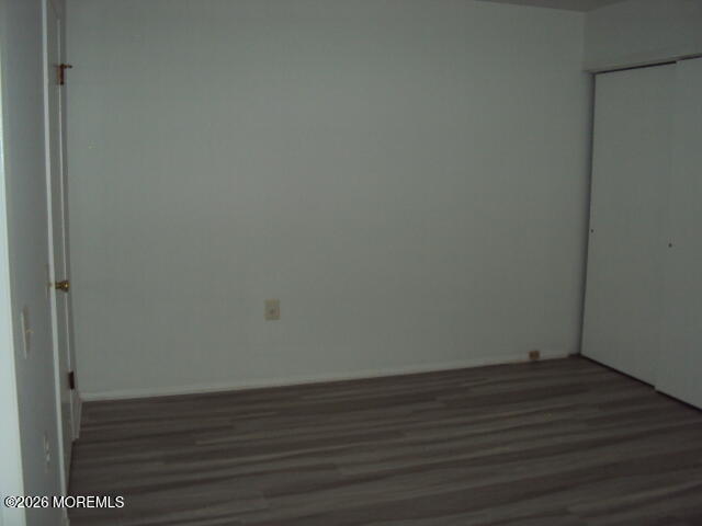 12 Spring Street, Unit D Whiting, NJ 08759 - Photo 8 of 14 a view of an empty room with wooden floor