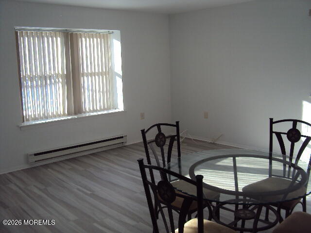 12 Spring Street, Unit D Whiting, NJ 08759 - Photo 9 of 14 a view of a dining room with furniture and window