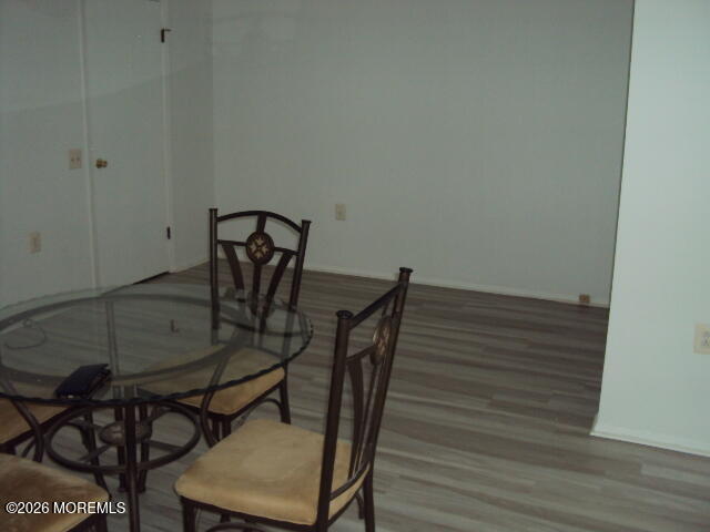 12 Spring Street, Unit D Whiting, NJ 08759 - Photo 10 of 14 a view of a dining room with furniture and wooden floor