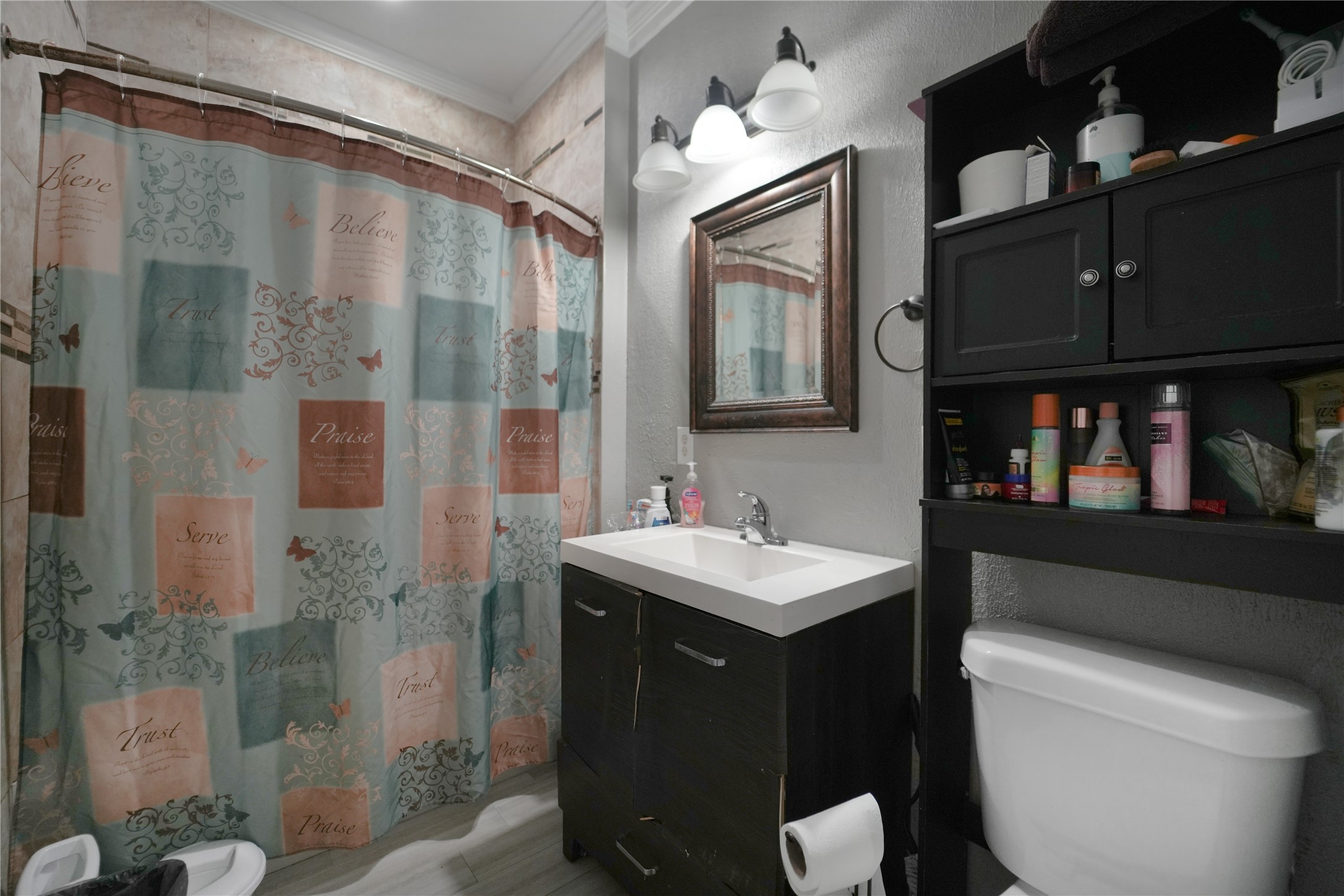 13475 5th Street Splendora, TX 77372 - Photo 13 of 16 a bathroom with a sink a toilet and shower