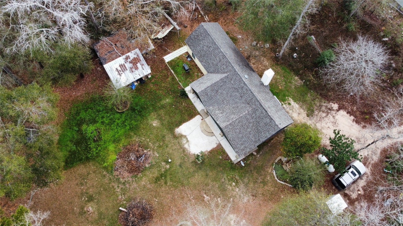 13475 5th Street Splendora, TX 77372 - Photo 14 of 16 a view of a house with a yard and garden