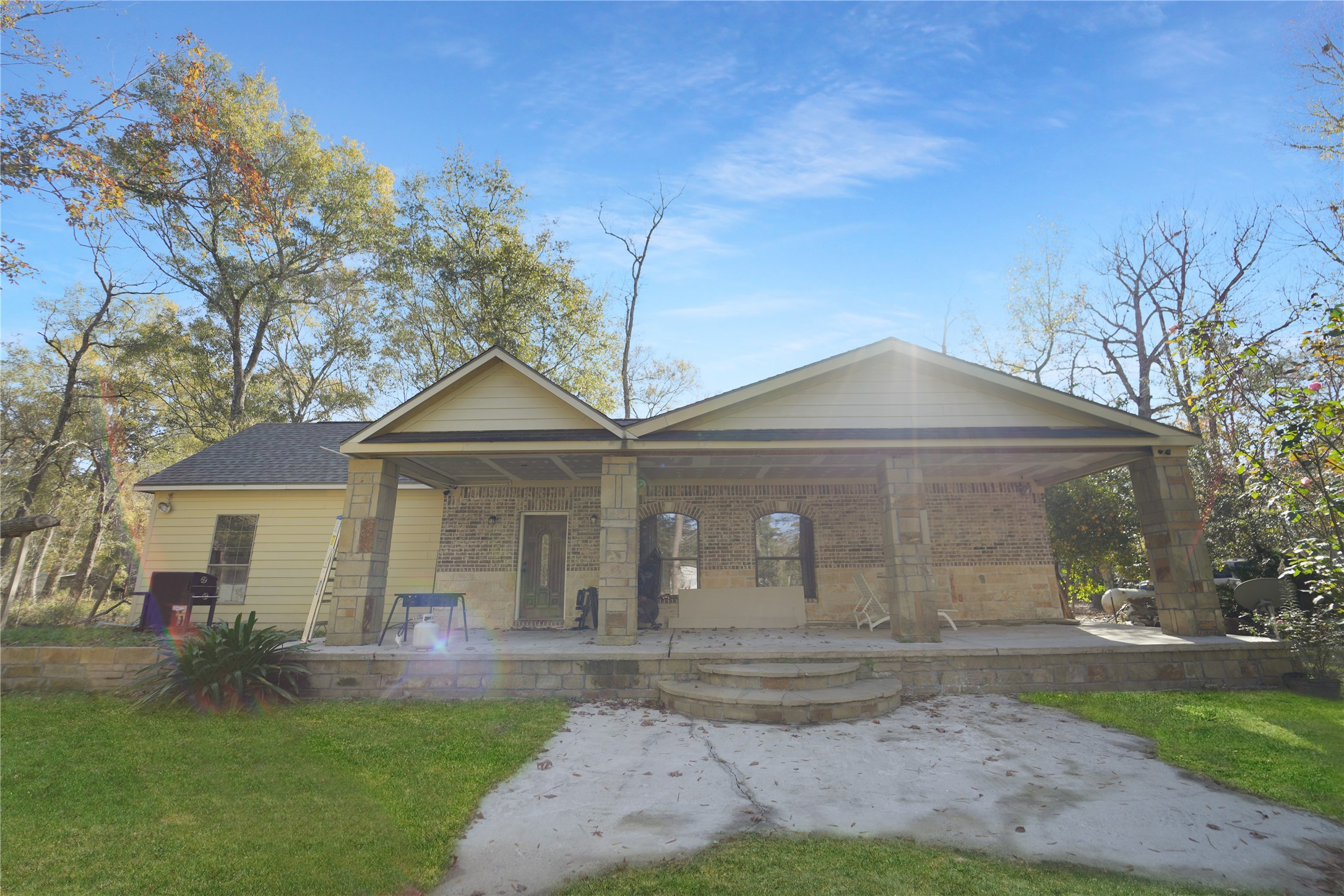 13475 5th Street Splendora, TX 77372 - Photo 2 of 16 a front view of a house with garden