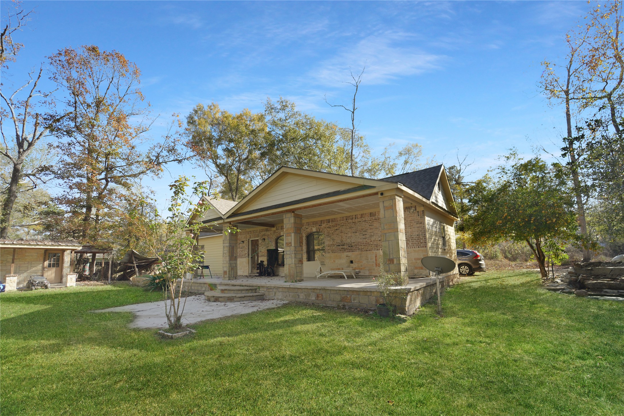13475 5th Street Splendora, TX 77372 - Photo 3 of 16 a view of a house with a yard