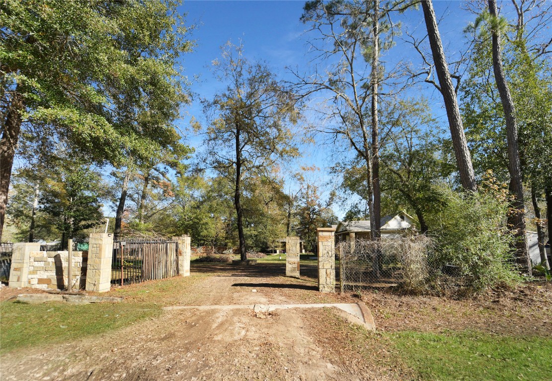 13475 5th Street Splendora, TX 77372 - Photo 5 of 16 a view of a house with trees in the background